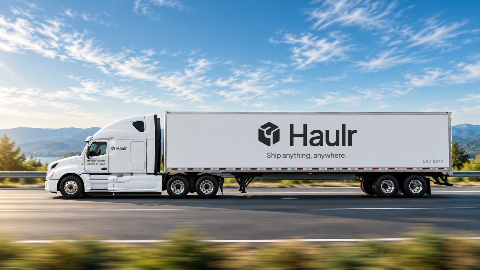 White Haulr semi truck driving along a highway under a blue sky